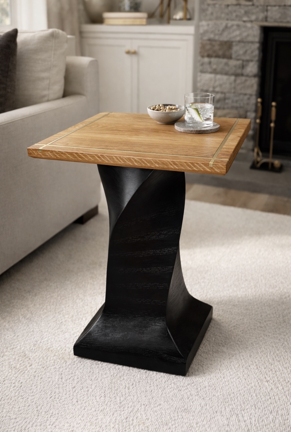 Oak accent table with brass-toned inlays and sculptural black twisted pedestal